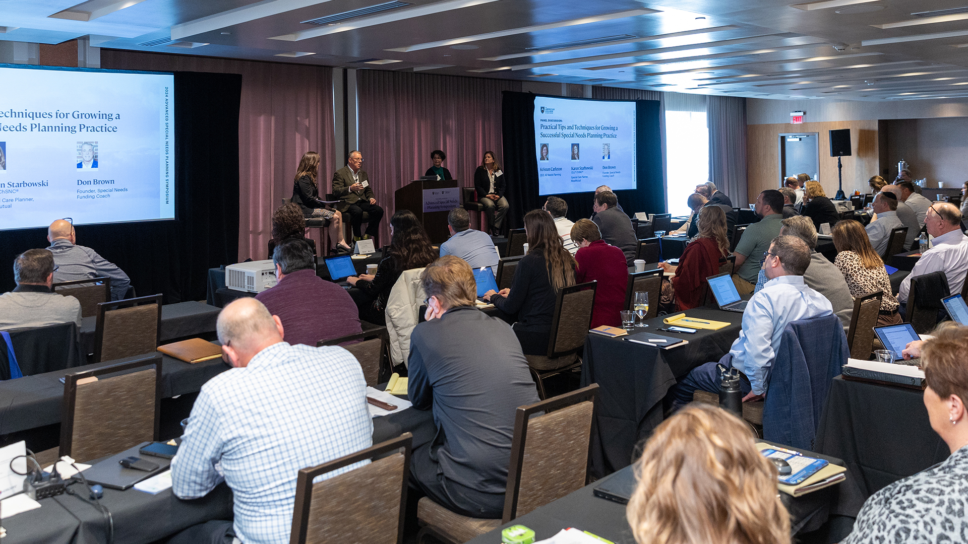 Attendees listening to a session at ASNP conference