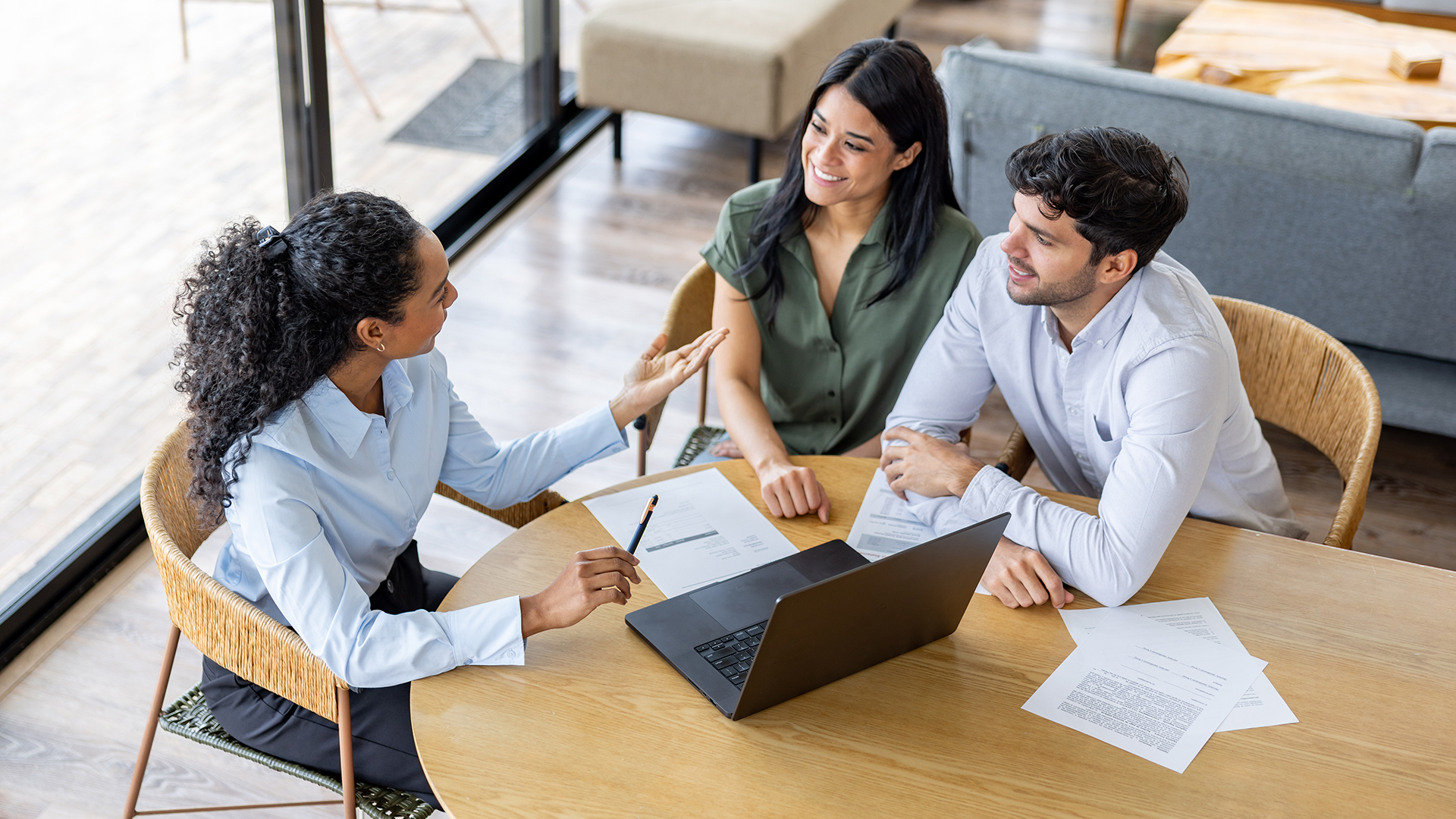 Female financial advisor meeting with a married couple