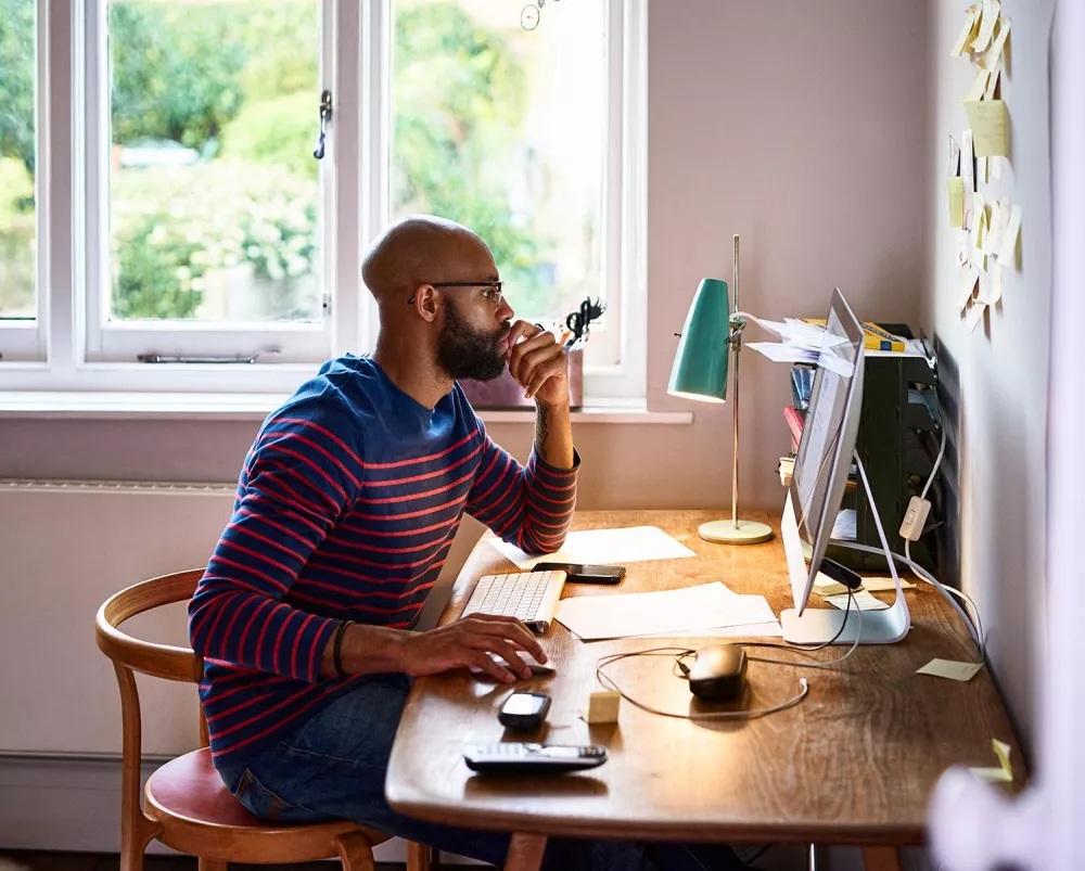 Financial services student studying at home on the computer