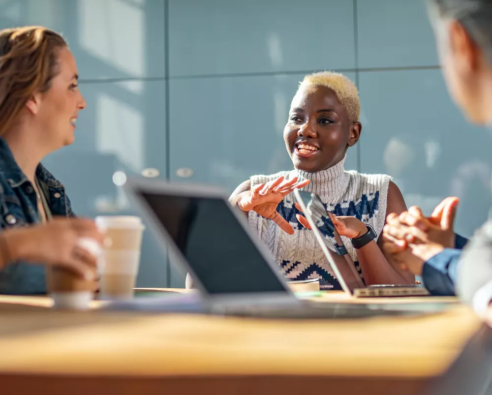 Diverse financial professionals talking in the conference room