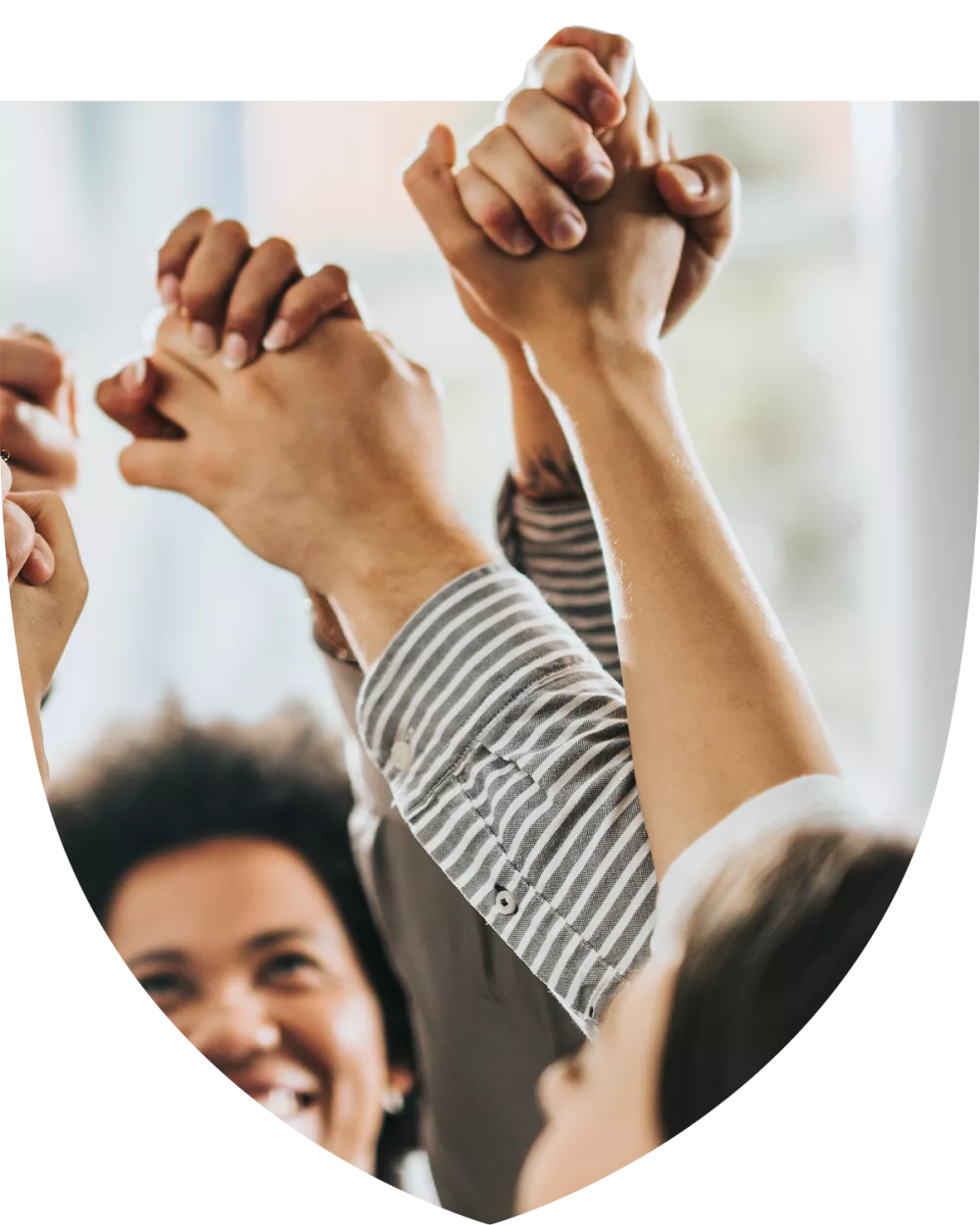 Group of happy people holding hands in solidarity