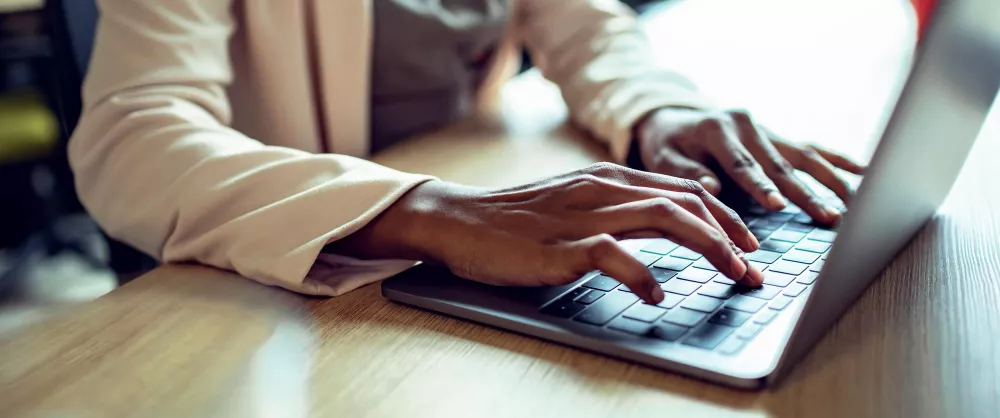 Woman's hands working on a laptop