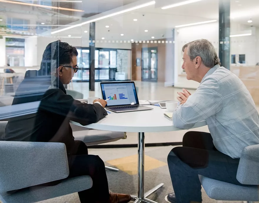 Two people meeting at a table