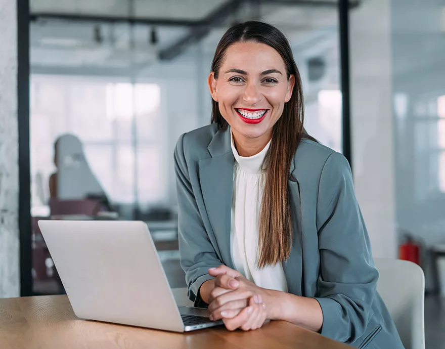 Woman sitting at a laptop