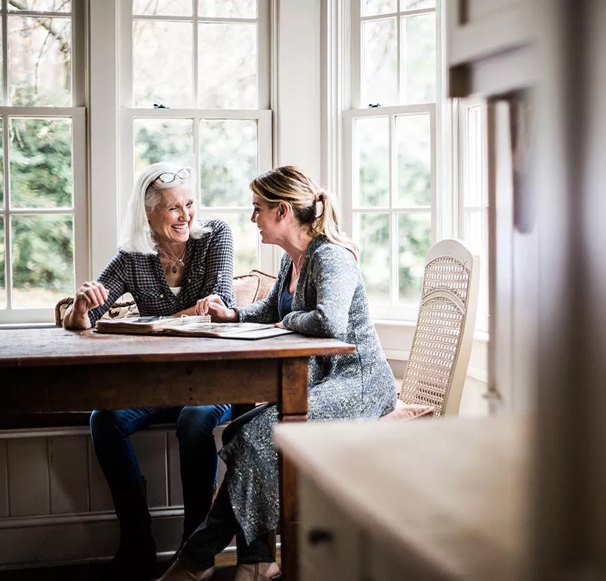 Two women talking at a table