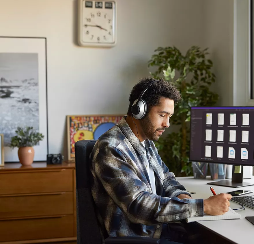 A man working at a desktop computer