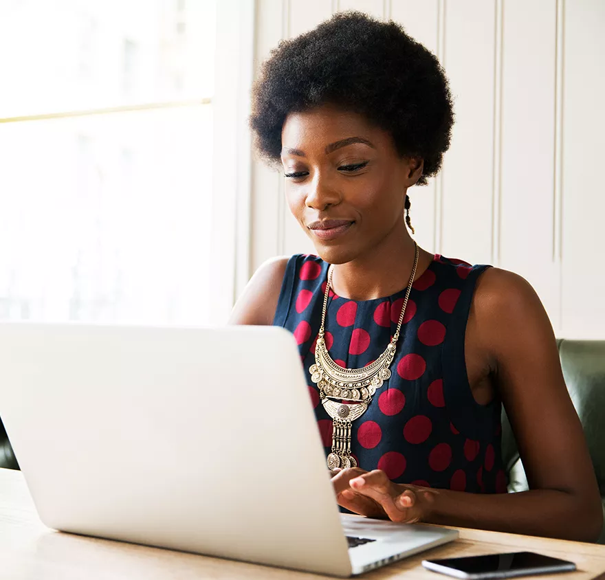 Woman sitting at a laptop