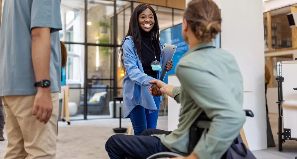 Female disability advocate helping a patient