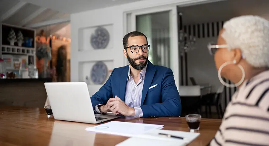 Advisor working with his client in their home