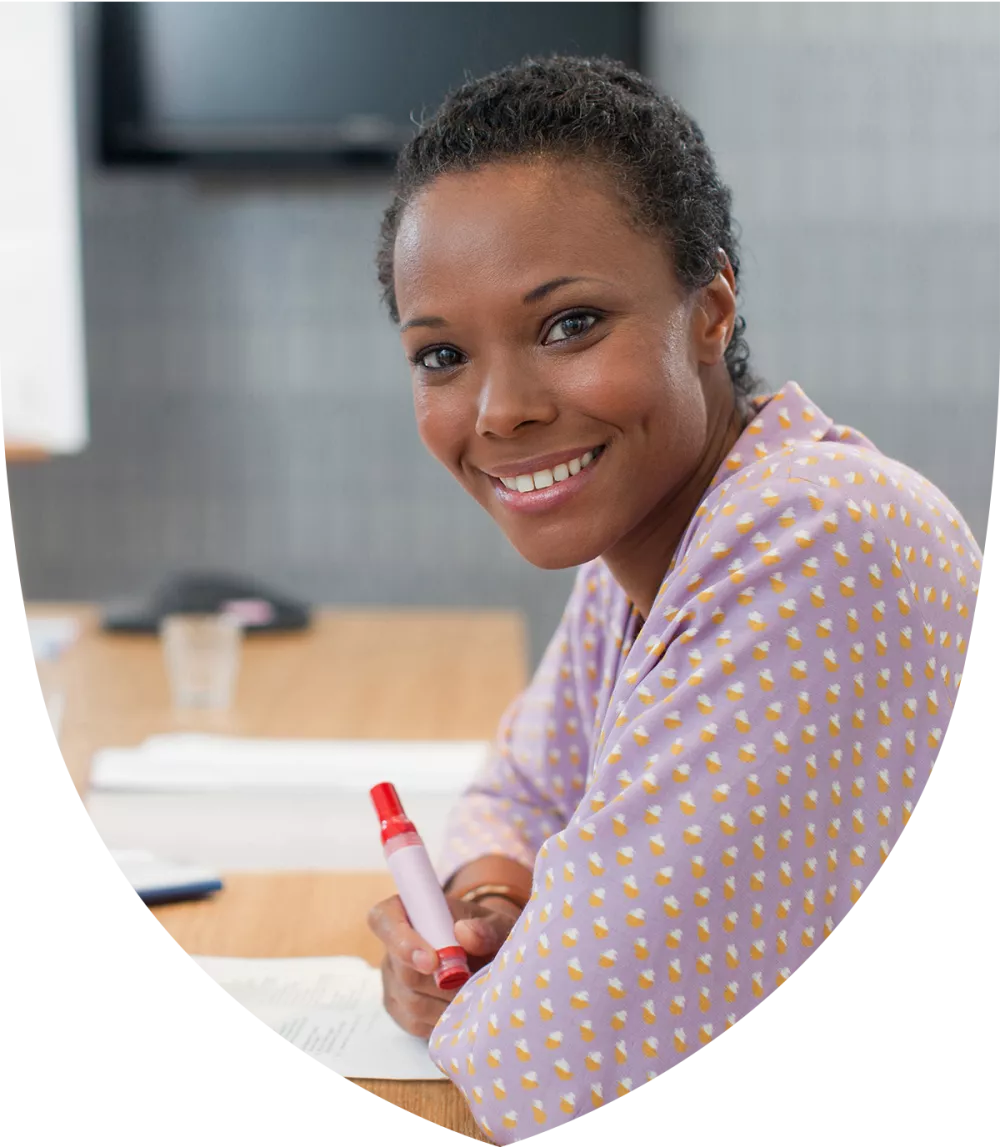 Female financial professional smiling at the table