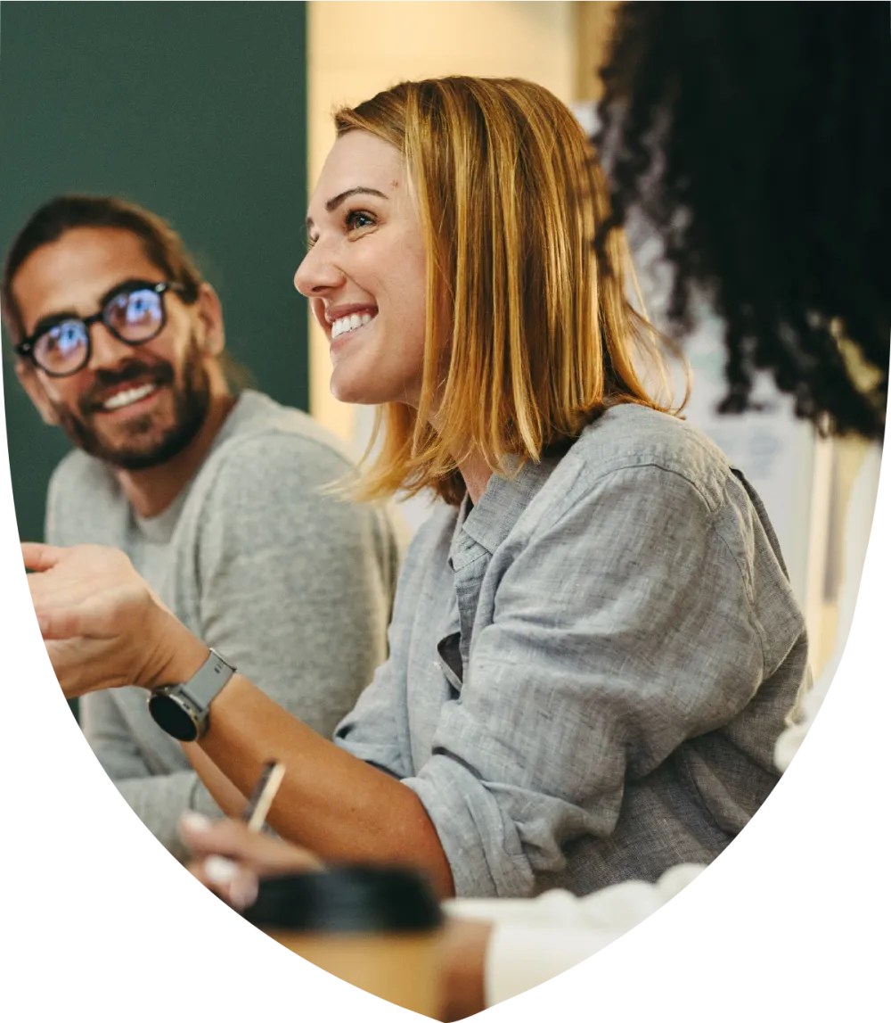 Young female professional smiling while in a meeting