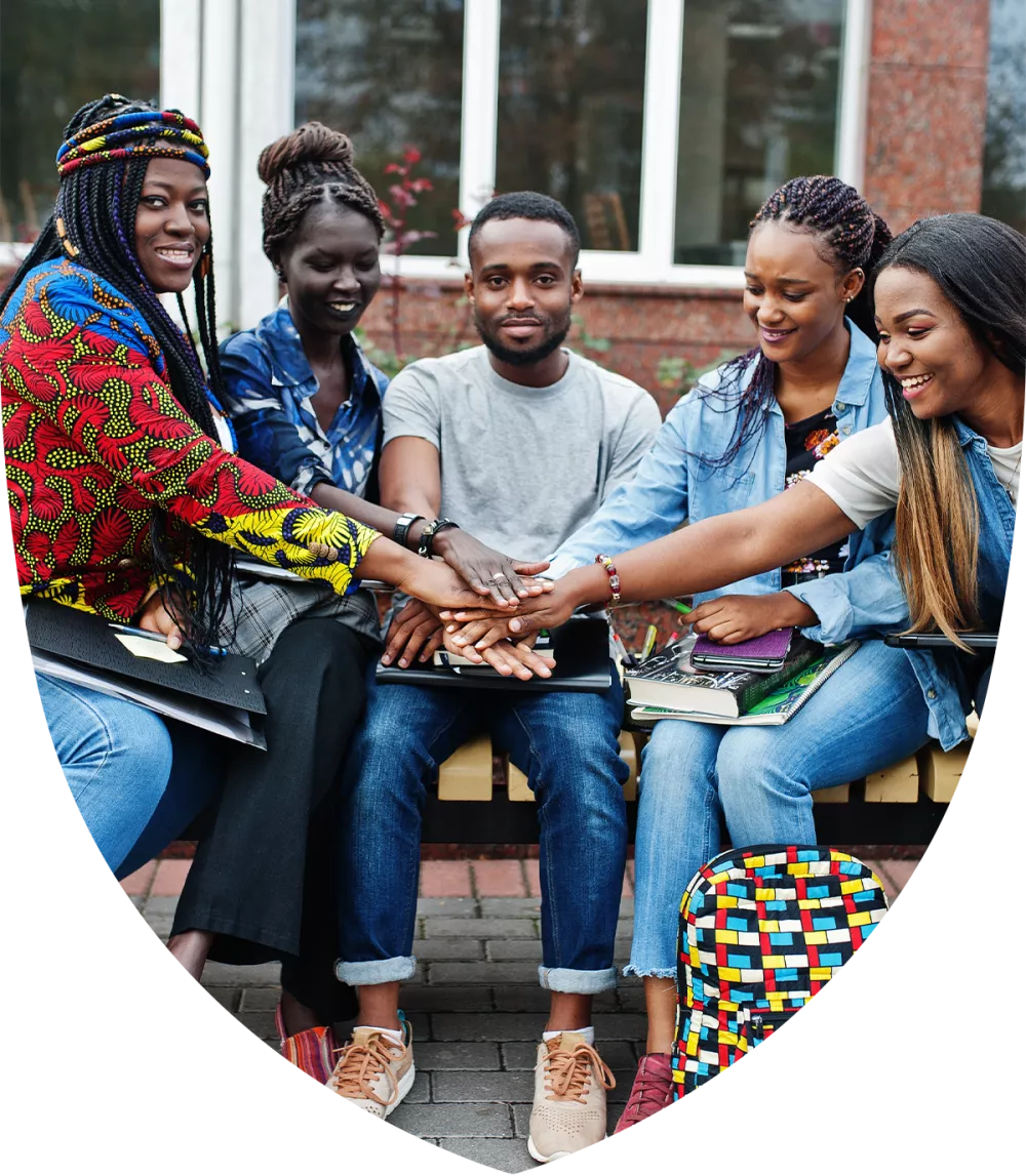 Group of black college students huddling together on campus