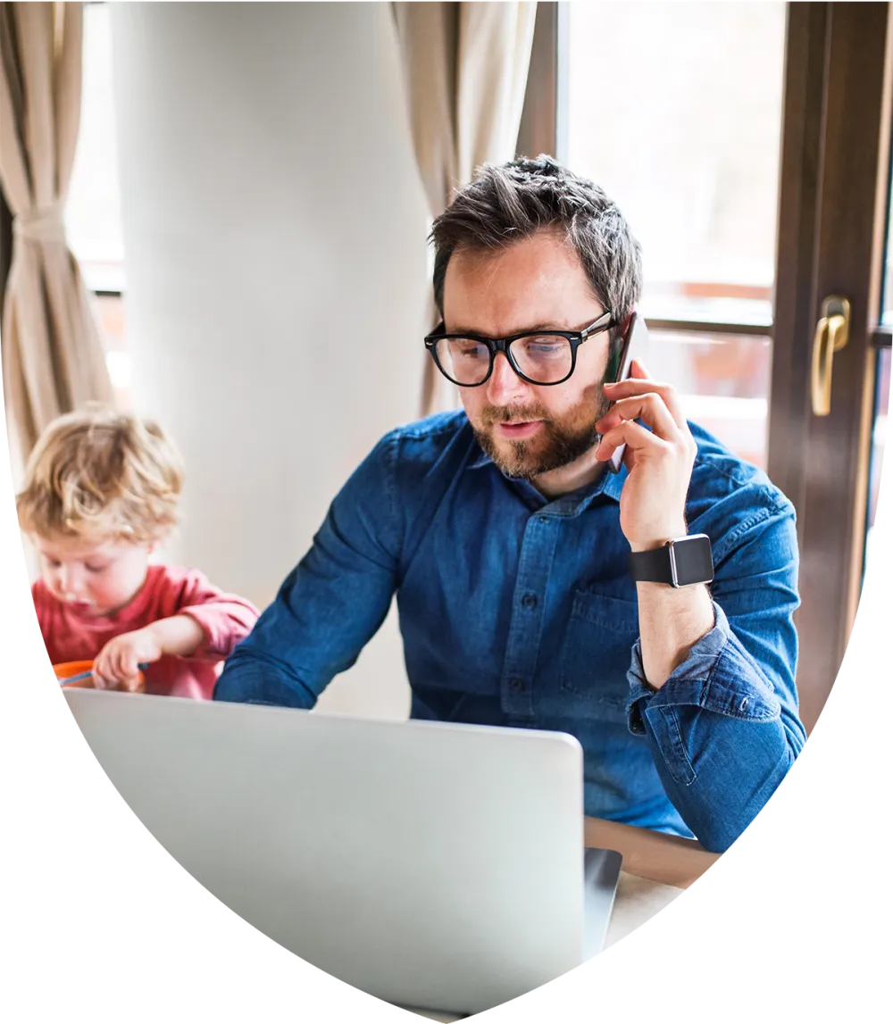 Middle aged man with glasses working at his computer