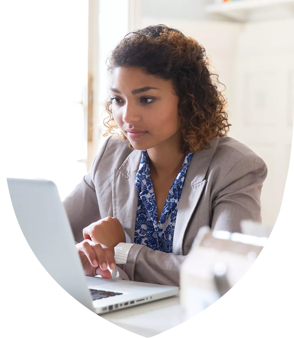 Woman of color working at her desk