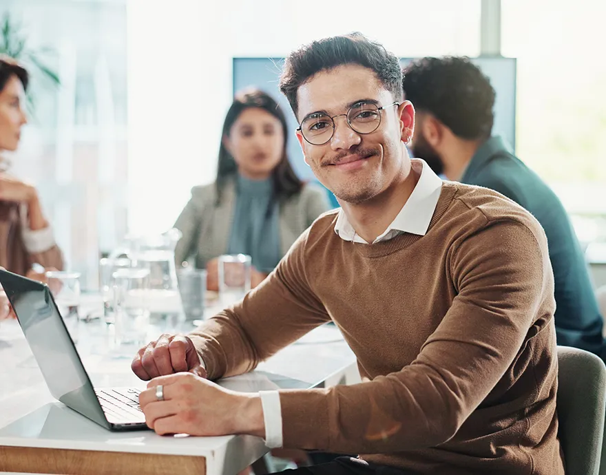 Young professional male with glasses smiling