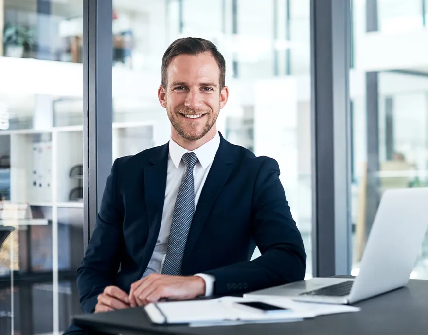 Middle aged businessman in a suit smiling