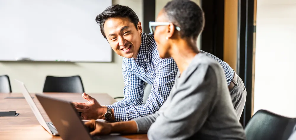 Male and female work colleagues having a meeting 