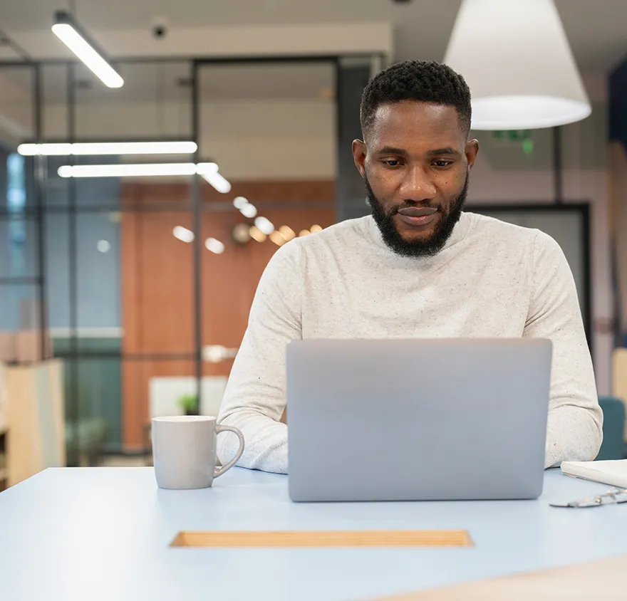 Middle aged man working on his laptop