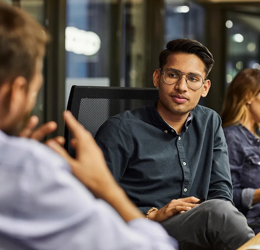 Two male colleagues having a meeting together