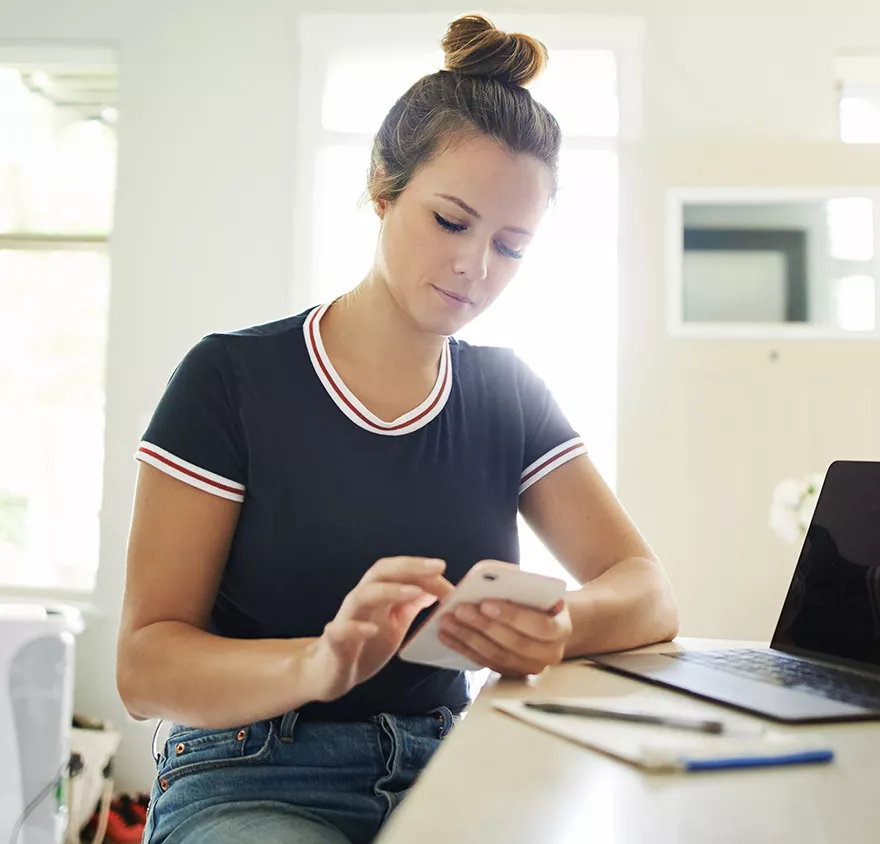 Female financial professional using her smartphone