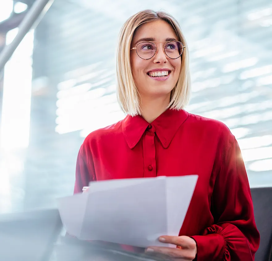 Young female professional wearing red shirt and smiling