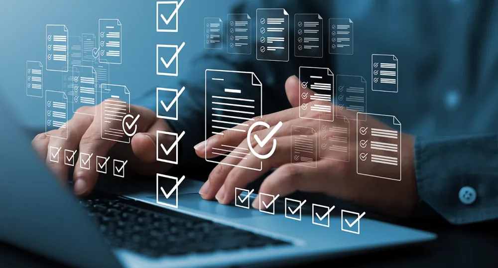 Man typing on his laptop