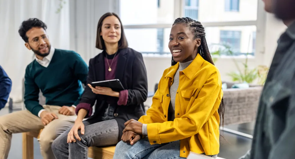 Diverse group of people talking in a group