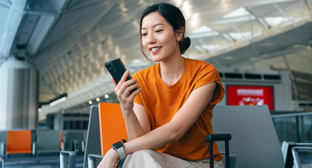 Woman tracking her retirement savings on her phone