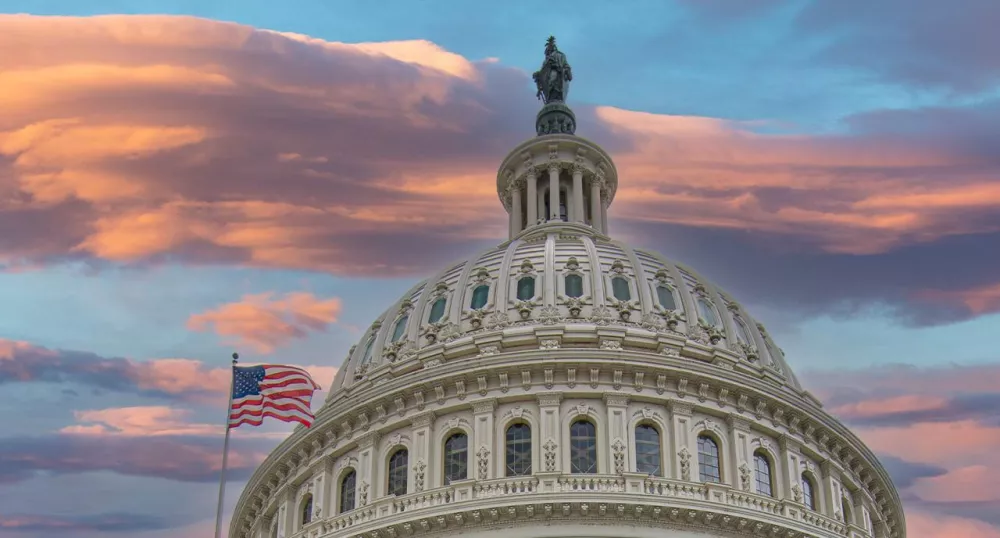 The US capitol building at sunset