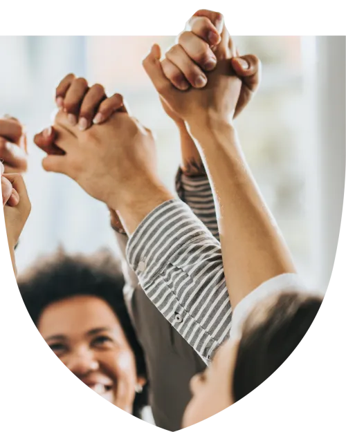 Group of happy people holding hands in solidarity
