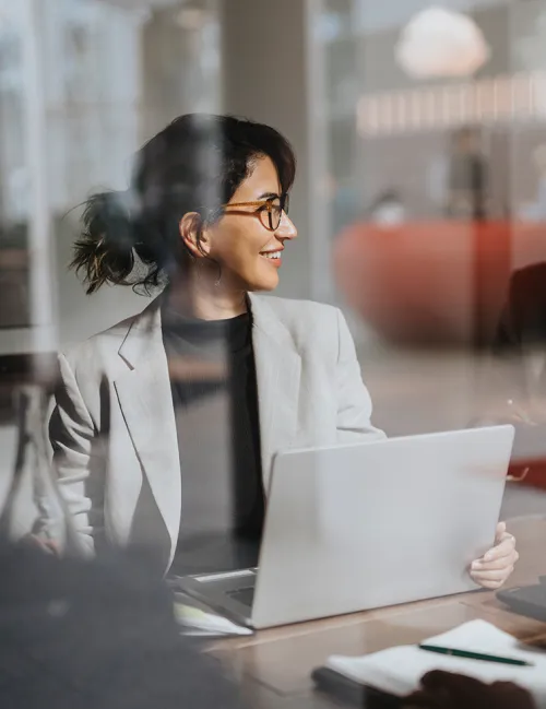 Middle aged female business professional smiling in the office