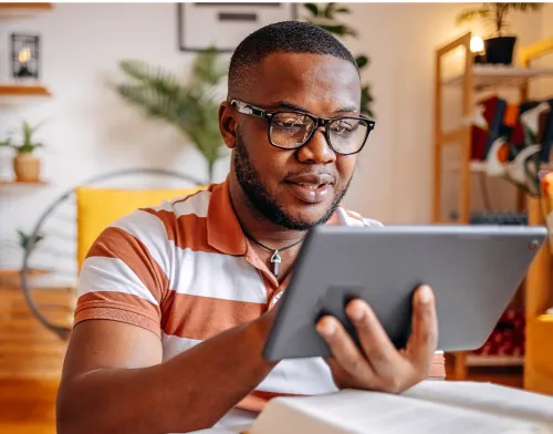 Man in his 30's working on a tablet