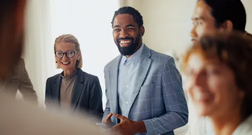Group of business professional smiling in a room