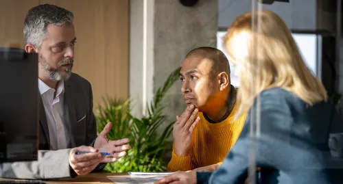 Male financial advisor speaking to a client