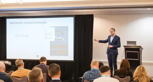 Wade Pfau presenting on stage at Horizons 