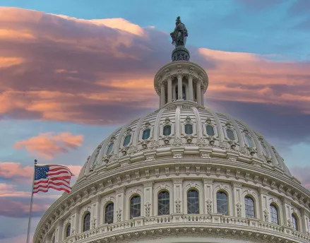 The US capitol building at sunset